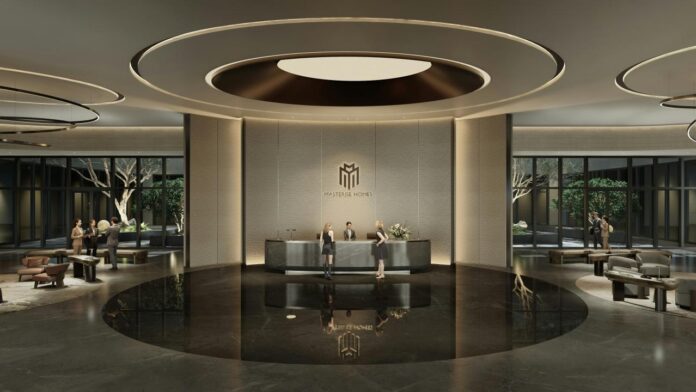 Lobi hotel modern dengan meja resepsionis dan area tempat duduk.